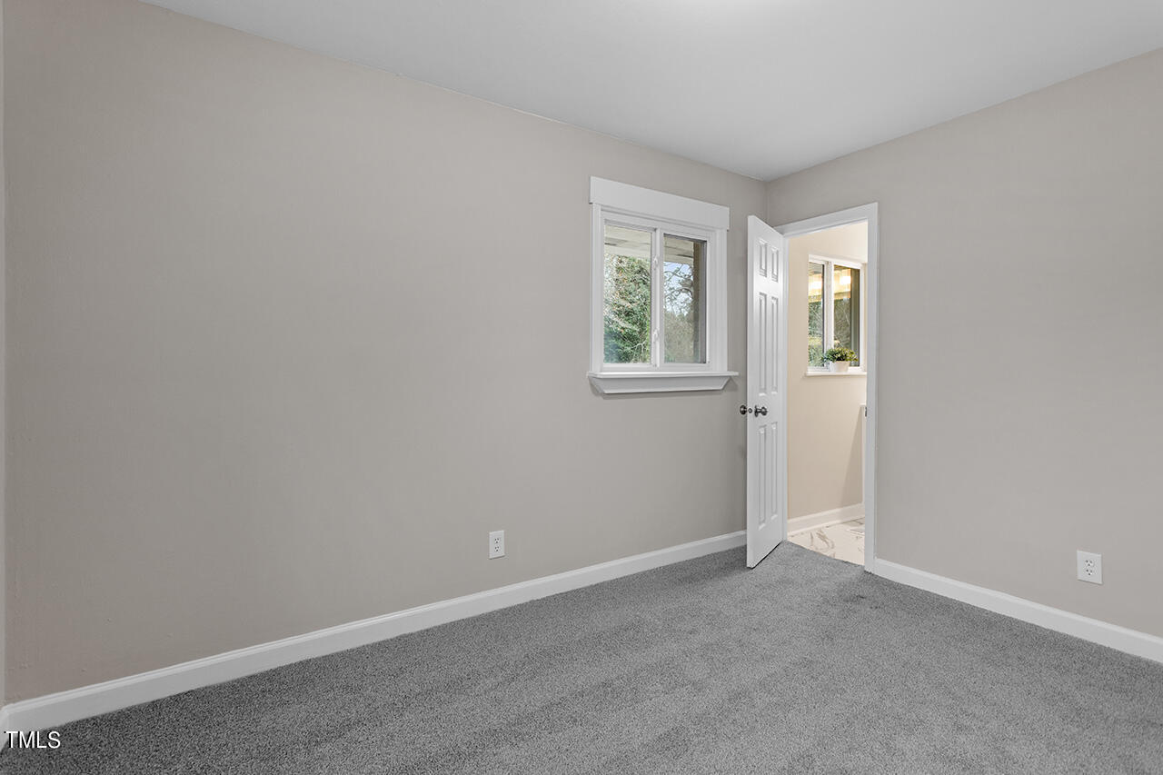 1610 Crescent Drive Spring Lake, NC 28390 - Photo 19 of 21 an empty room with windows