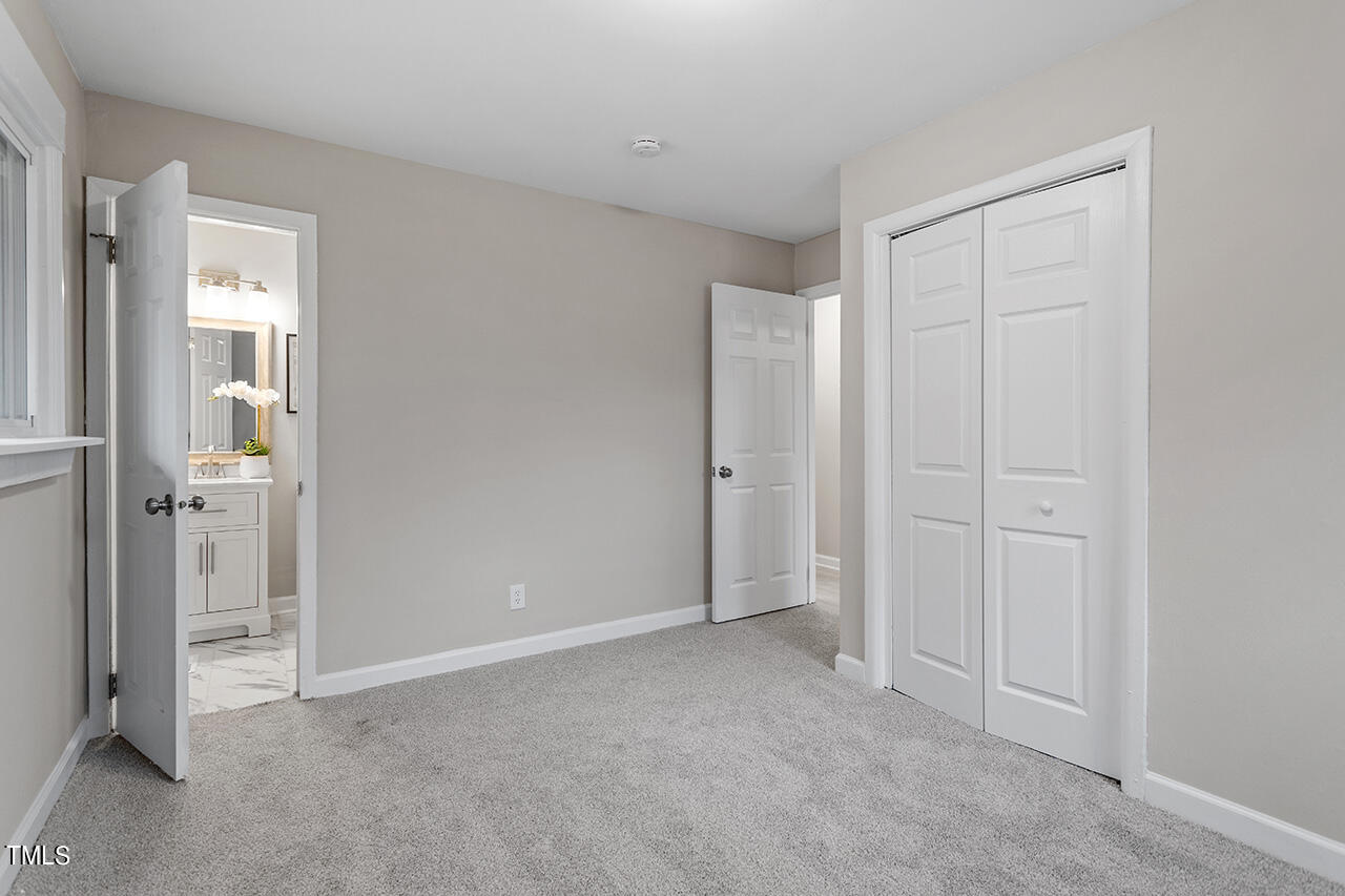 1610 Crescent Drive Spring Lake, NC 28390 - Photo 20 of 21 an empty room with windows