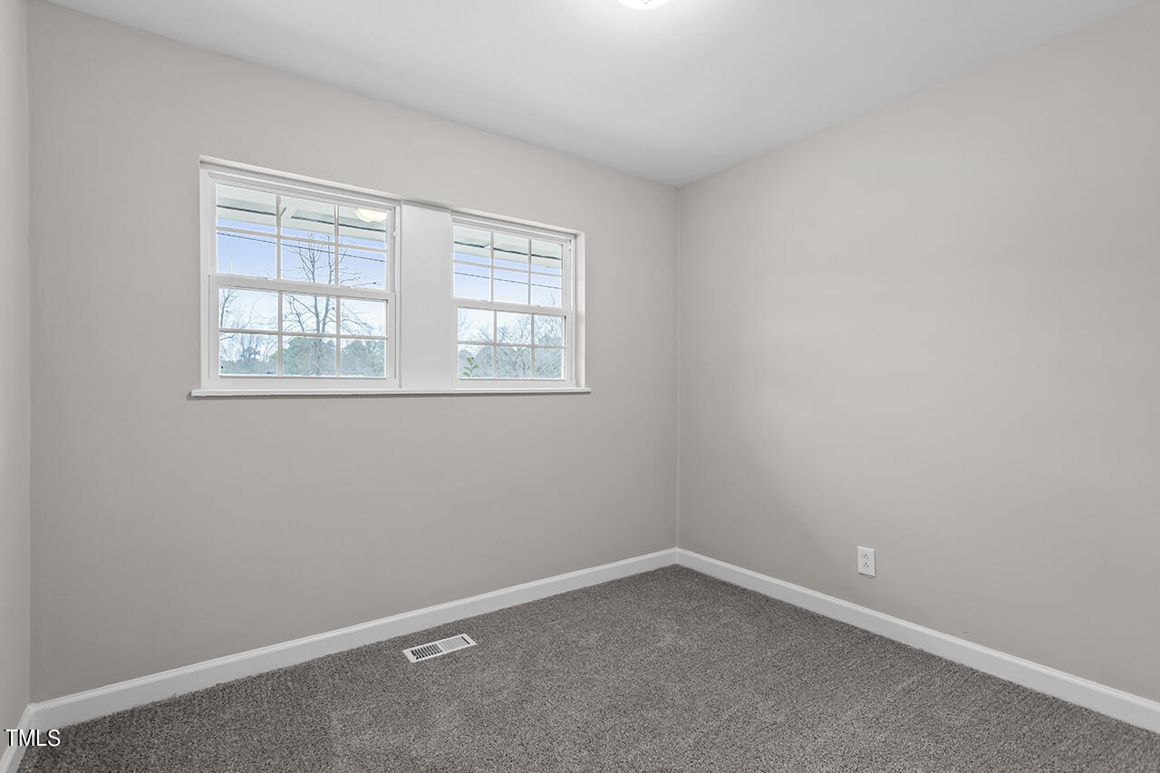 1610 Crescent Drive Spring Lake, NC 28390 - Photo 10 of 21 an empty room with a window