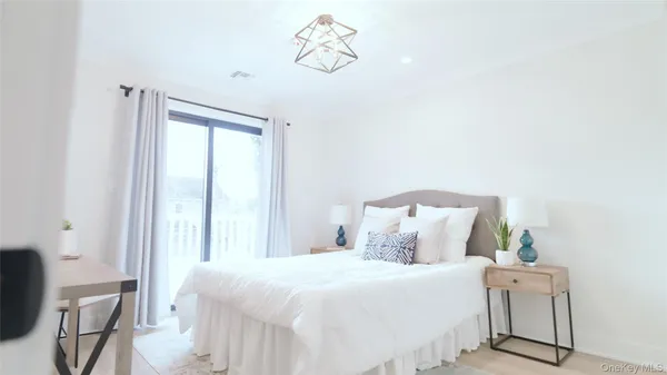 a bedroom with a bed and window