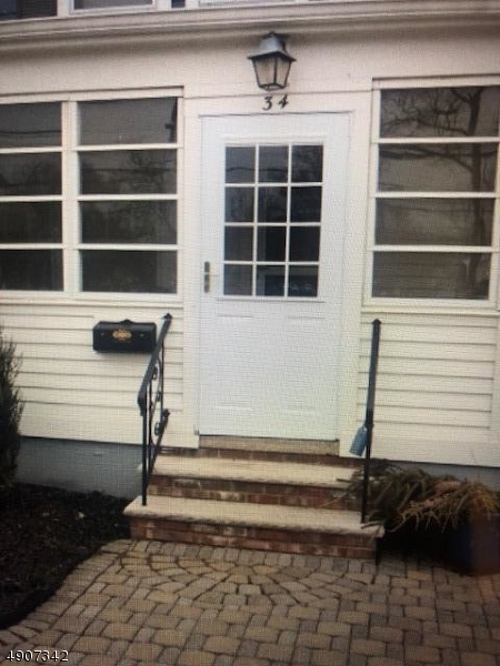 32 West Maple Avenue Bound Brook, NJ 08805 - Photo 2 of 12 a front view of a house with a window