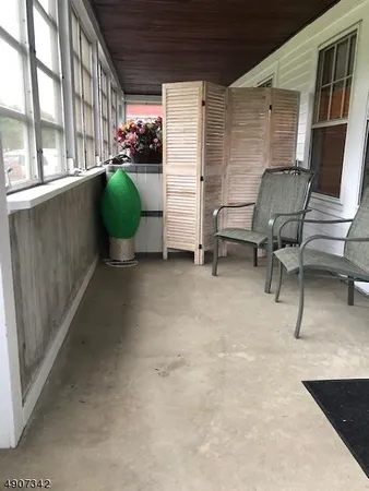 a workspace with furniture and a window