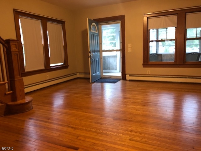 32 West Maple Avenue Bound Brook, NJ 08805 - Photo 5 of 12 a view of an empty room with wooden floor and a window