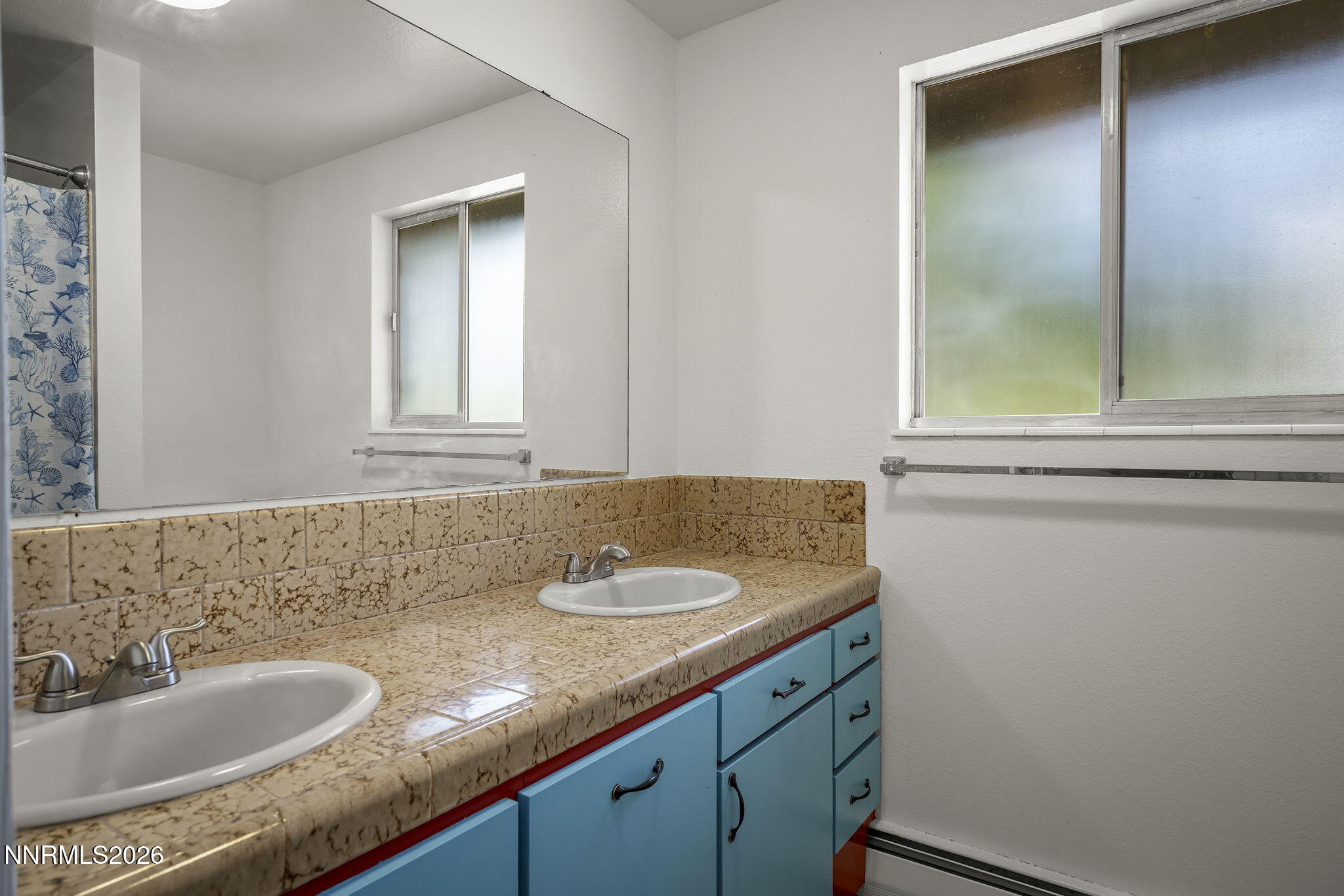 549 Ruby Lane Carson City, NV 89706 - Photo 21 of 37 a bathroom with a granite countertop sink and a mirror