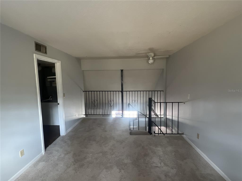 11558 Southeast 58th Avenue Belleview, FL 34420 - Photo 11 of 26 a view of staircase and utility room