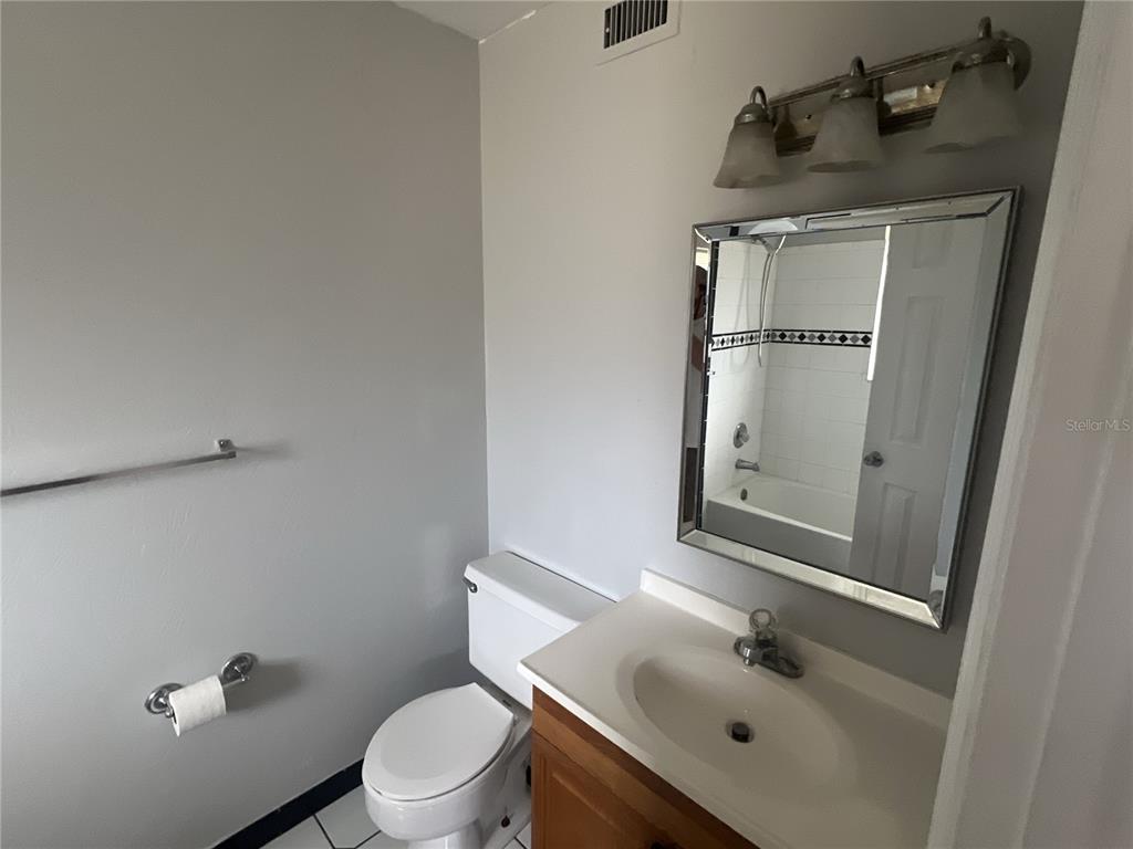 11558 Southeast 58th Avenue Belleview, FL 34420 - Photo 12 of 26 a bathroom with a sink a toilet and shower