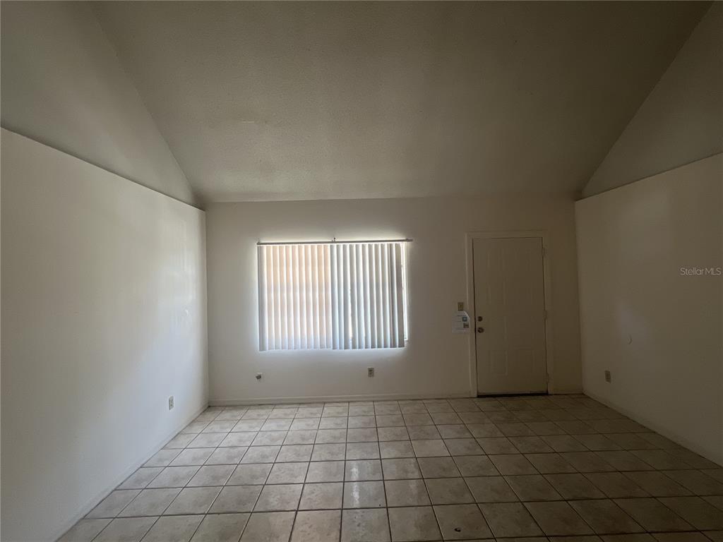 11558 Southeast 58th Avenue Belleview, FL 34420 - Photo 15 of 26 a view of an empty room with a window