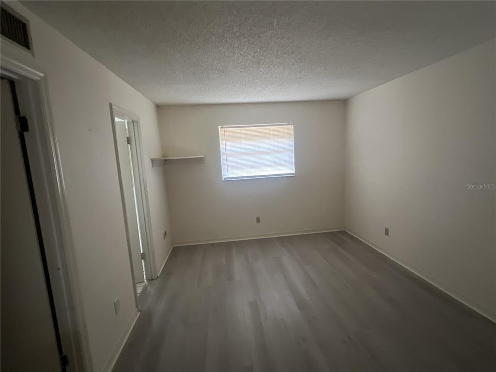 11558 Southeast 58th Avenue Belleview, FL 34420 - Photo 22 of 26 an empty room with a window