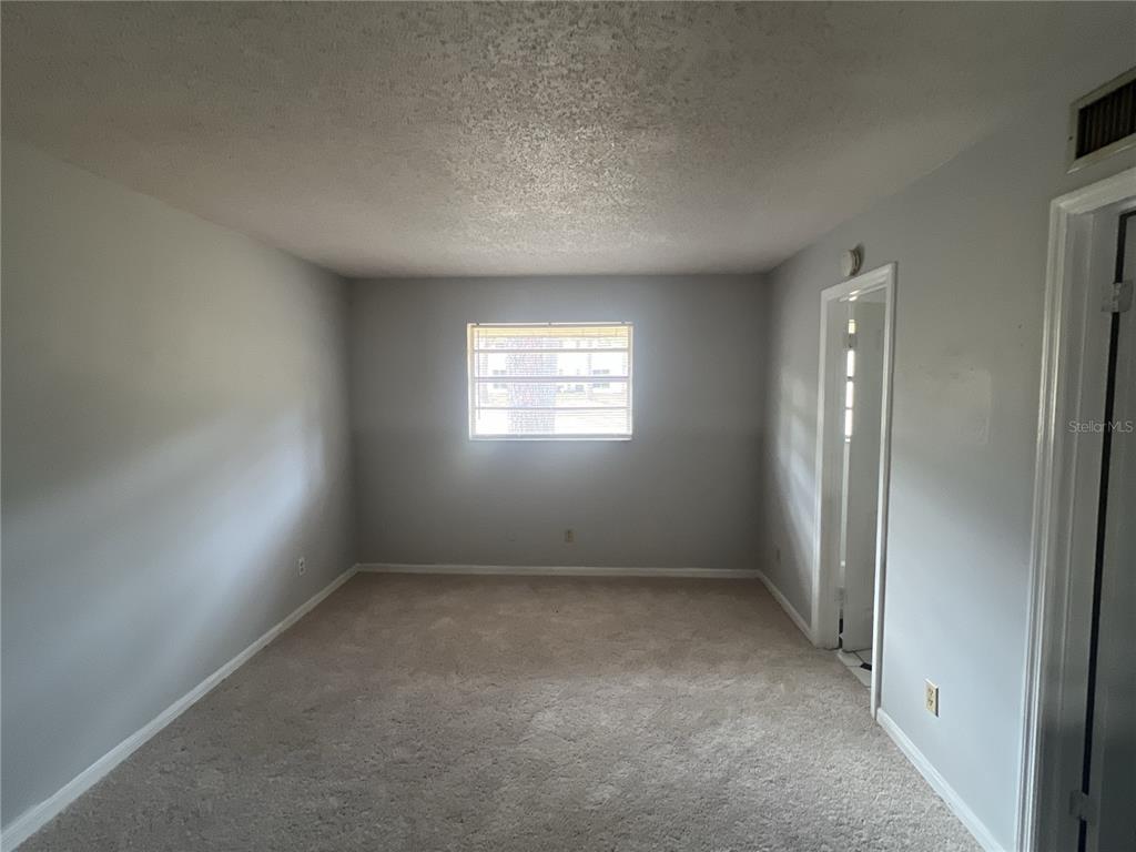 11558 Southeast 58th Avenue Belleview, FL 34420 - Photo 10 of 26 an empty room with windows