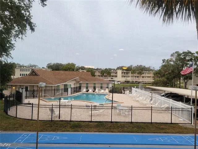 a view of a swimming pool with a lake view
