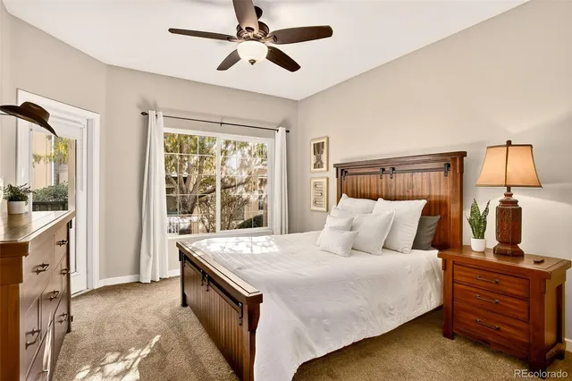 a bed room with a bed and a window