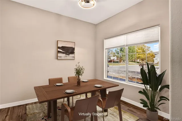 a view of a dining room with furniture window and outside view