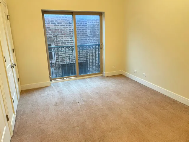 a view of an empty room with a fireplace