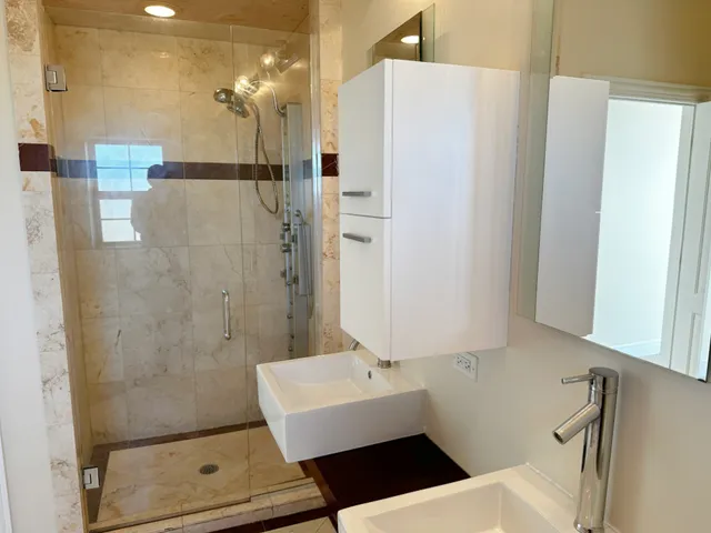 a bathroom with a bathtub and a shower