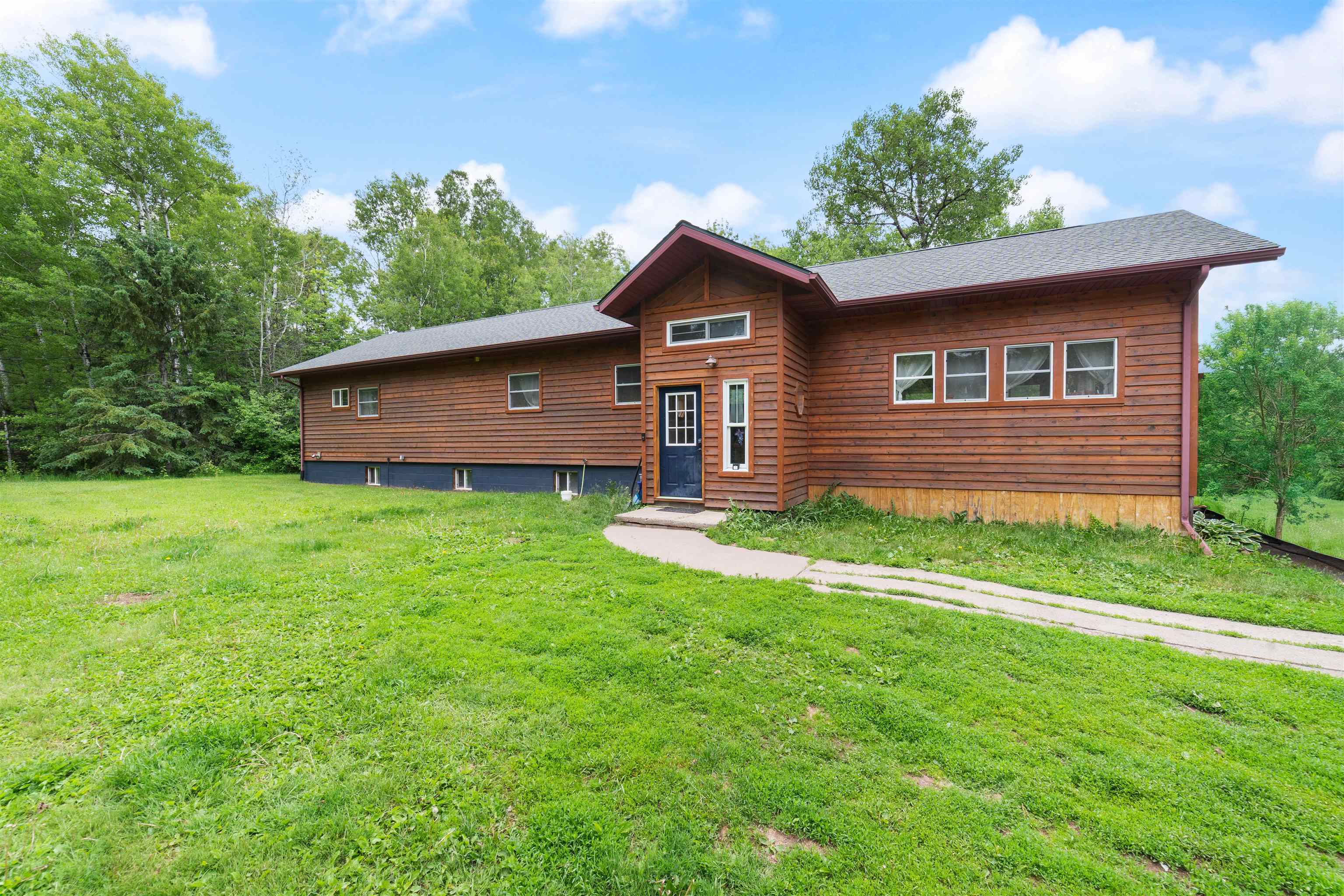 Rustic home with a front lawn