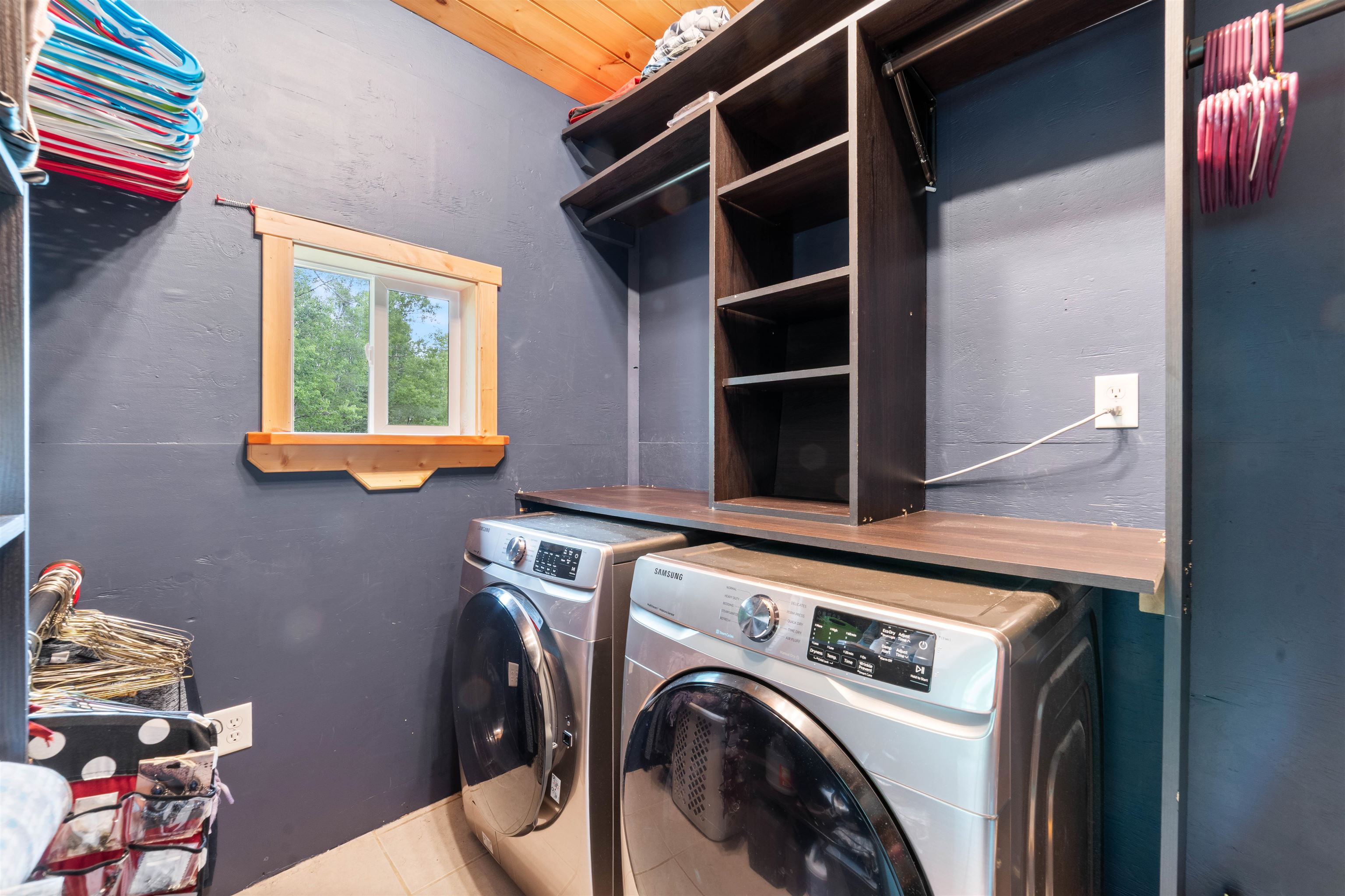 4767 McComber Road Duluth, MN 55803 - Photo 11 of 26 Washroom featuring washing machine and clothes dryer and tile patterned flooring