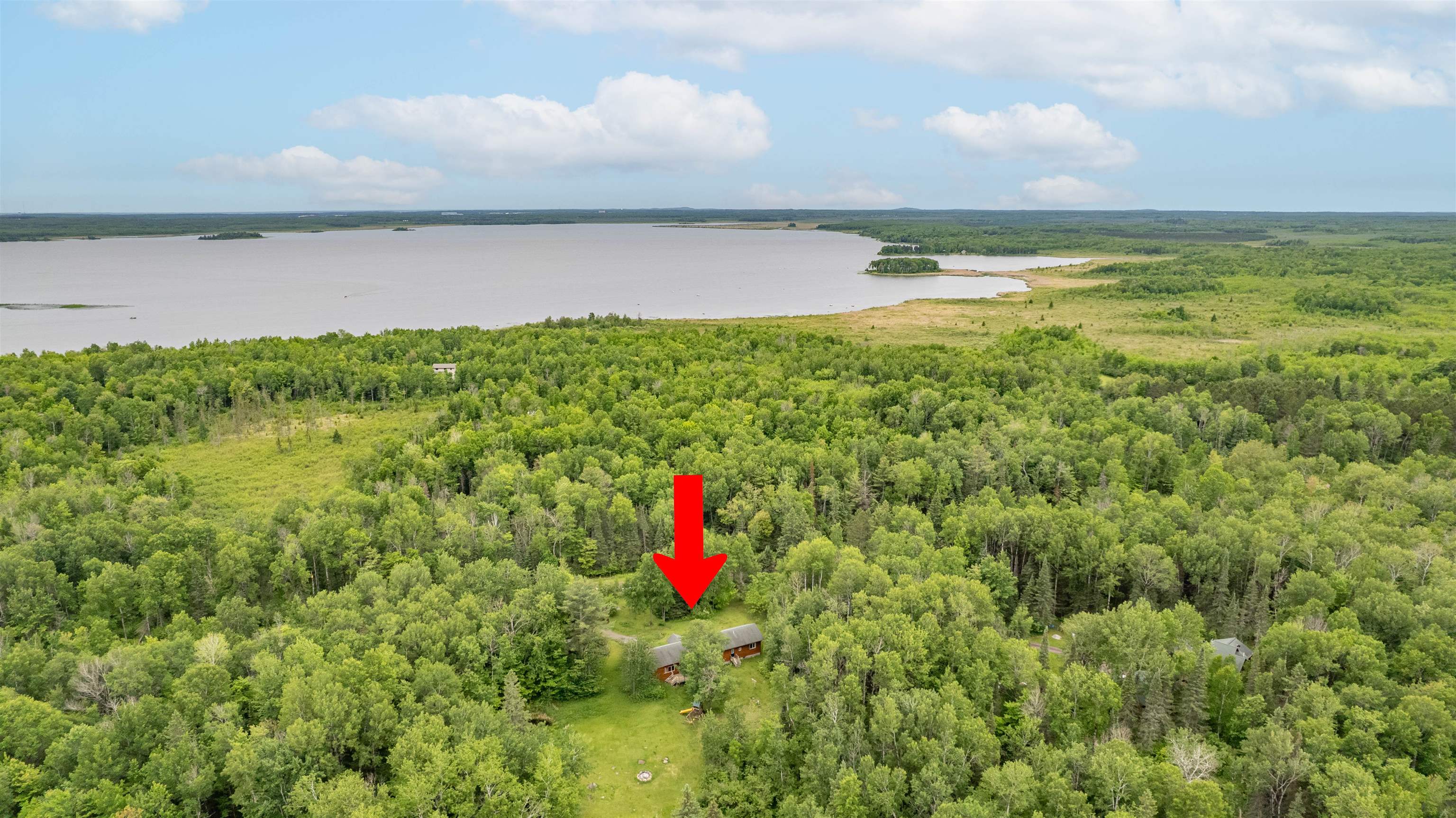 4767 McComber Road Duluth, MN 55803 - Photo 17 of 26 Drone / aerial view of a large body of water and a heavily wooded area