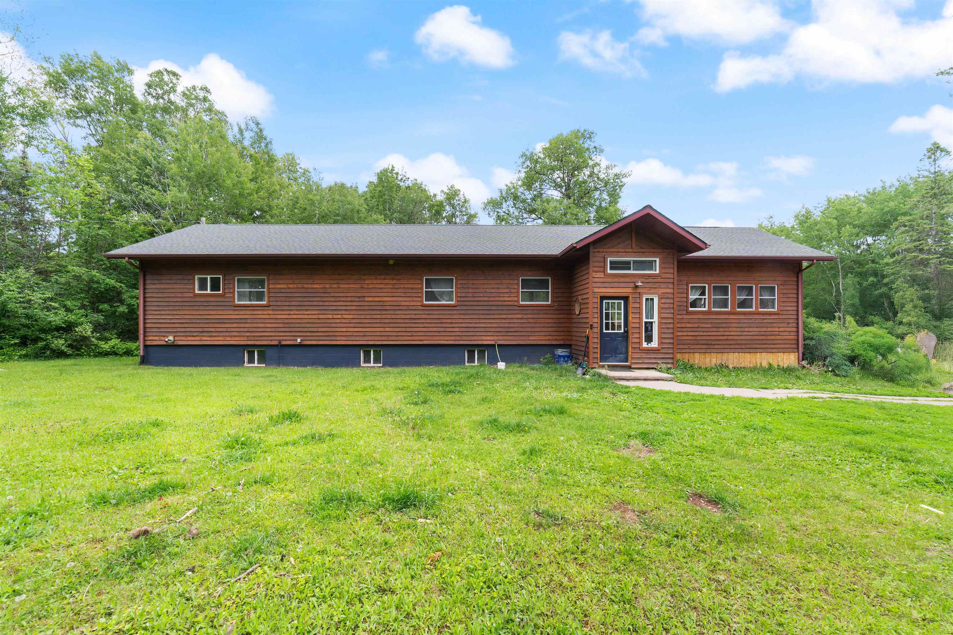 4767 McComber Road Duluth, MN 55803 - Photo 22 of 26 Chalet / cabin featuring a front yard and entry steps