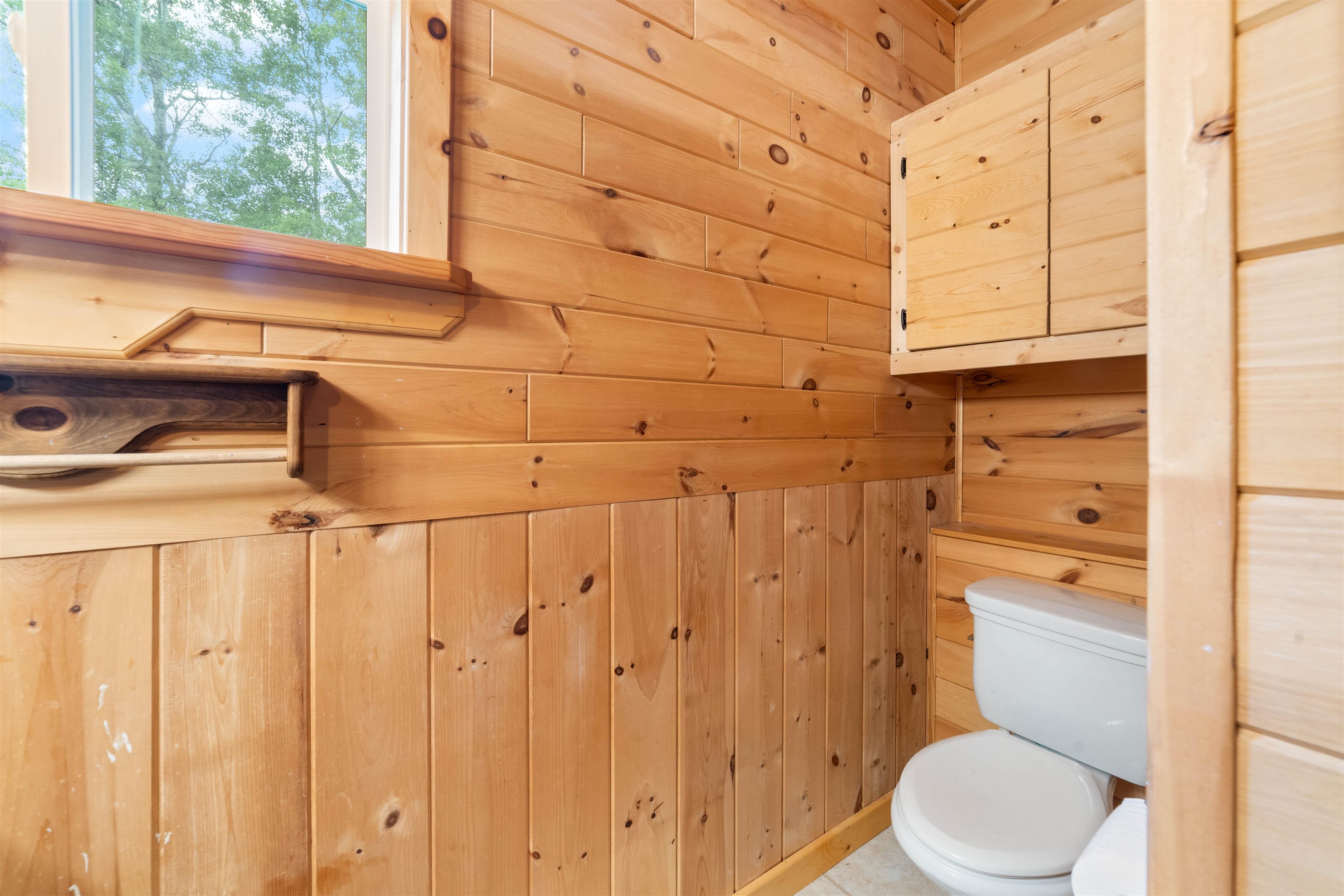 4767 McComber Road Duluth, MN 55803 - Photo 5 of 26 Bathroom with wood walls and toilet