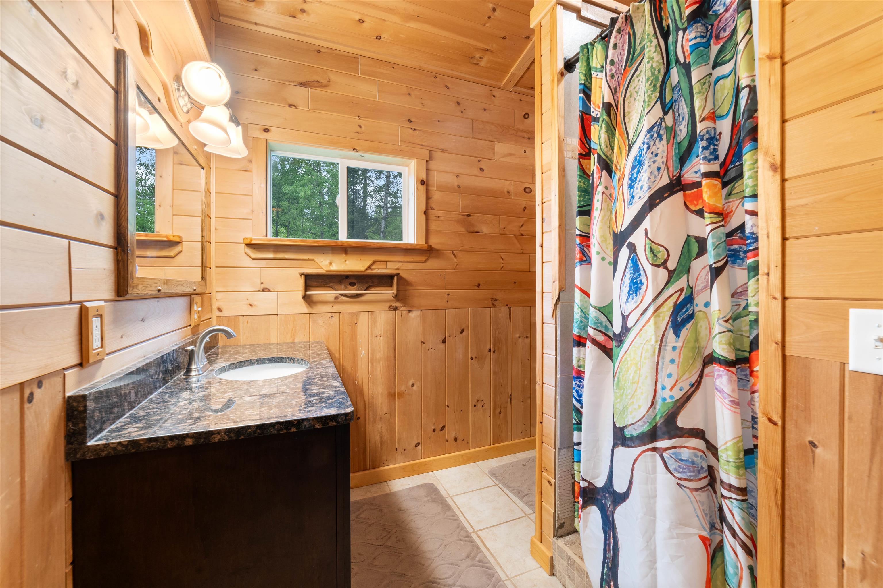 4767 McComber Road Duluth, MN 55803 - Photo 7 of 26 Full bathroom with wooden walls, vanity, a shower with curtain, and wooden ceiling