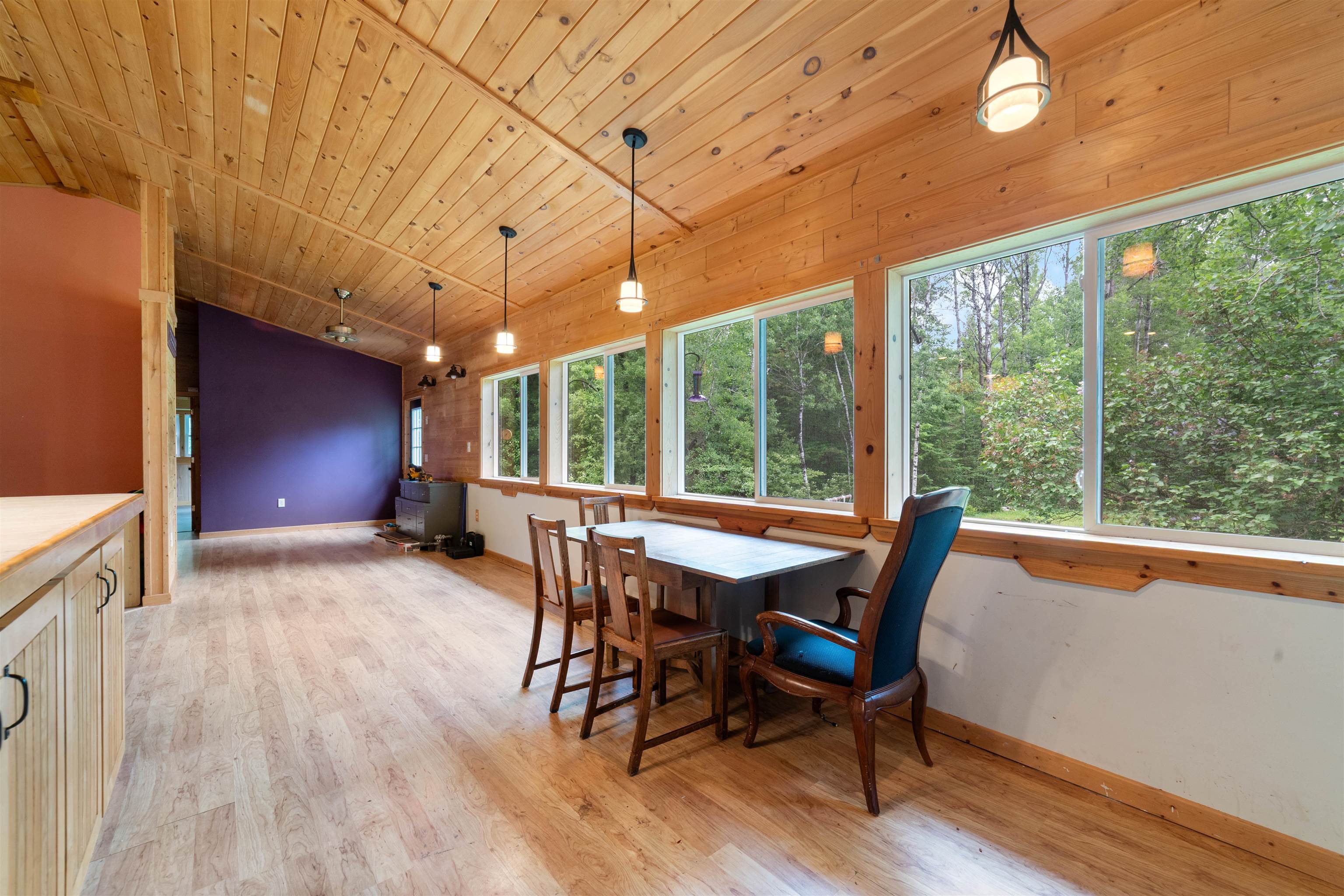 4767 McComber Road Duluth, MN 55803 - Photo 8 of 26 Dining space featuring vaulted ceiling, light wood-type flooring, and wood ceiling