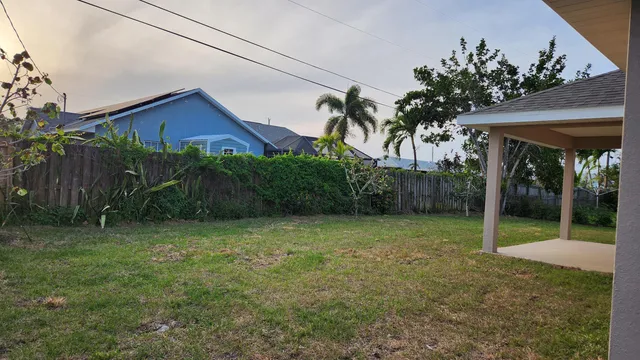 a house with a tree in front of it