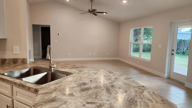 a view of a kitchen with a sink and dishwasher