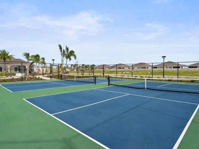 a view of an outdoor space and tennis court