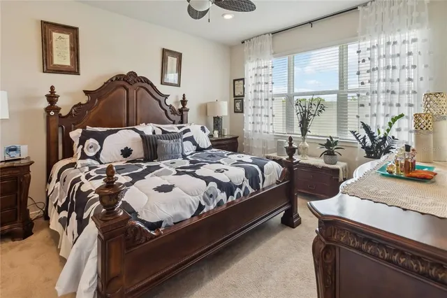 a bedroom with bed and a window