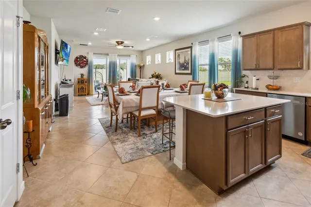 a kitchen with sink cabinets and outdoor dining space