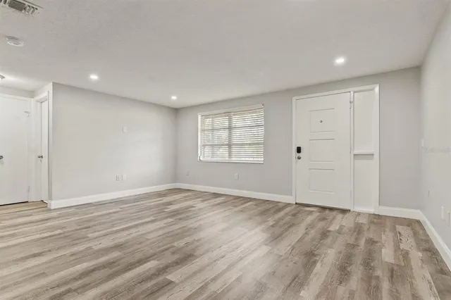 a view of an empty room and window