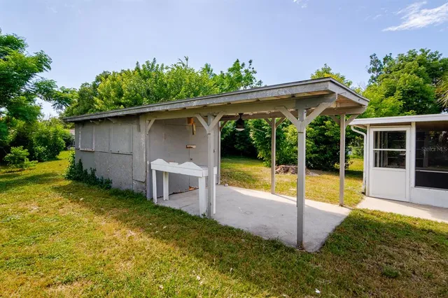 a view of a house with pool and garden