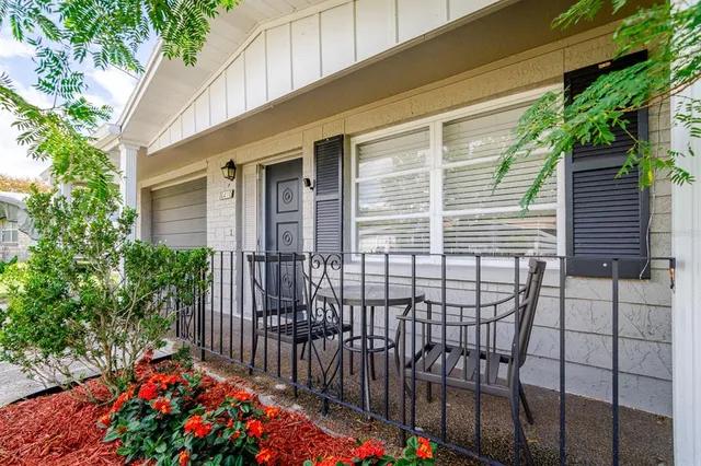 a view of a house with a flower garden
