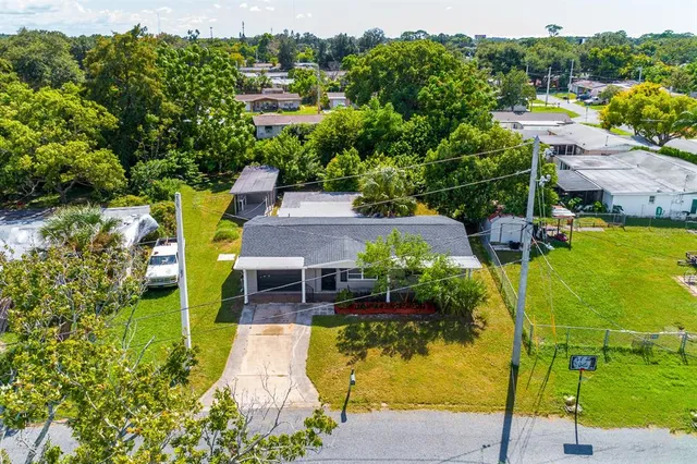 an aerial view of a house with a swimming pool