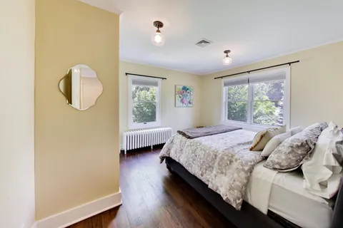 a bedroom with a bed and window