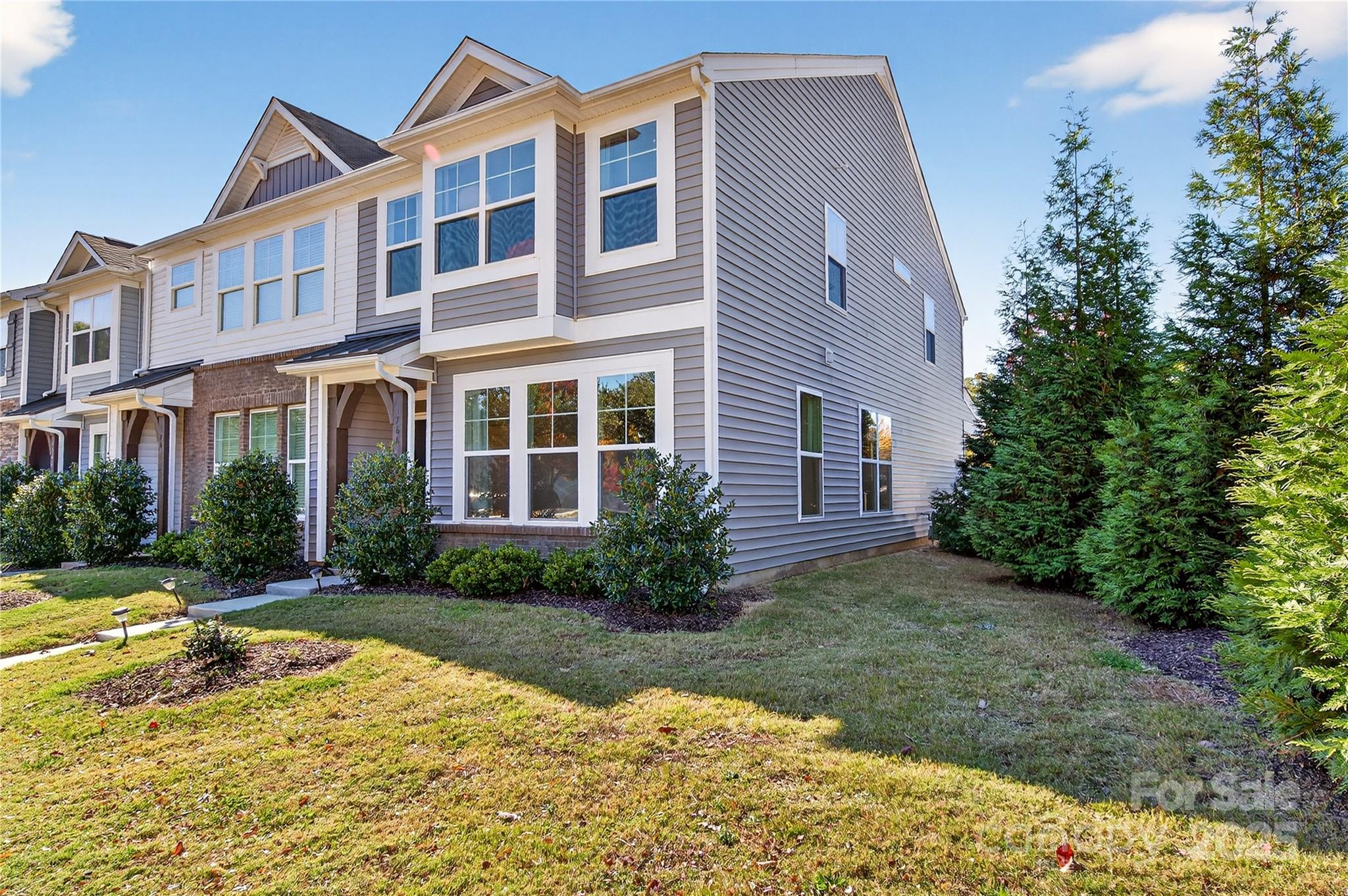 176 Waterlynn Ridge Road Mooresville, NC 28117 - Photo 2 of 25 a view of a brick building next to a yard