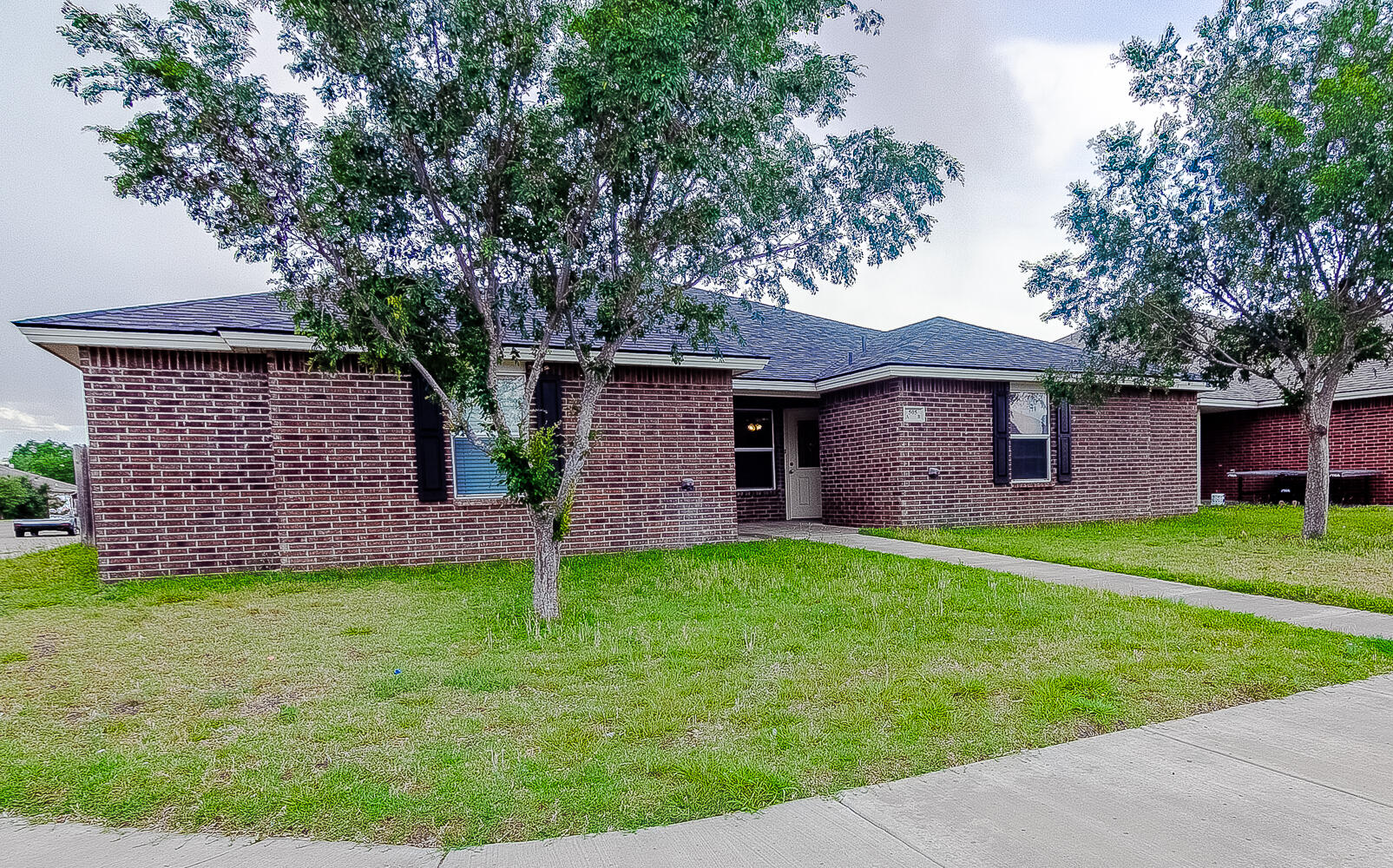 505 North Chicago Avenue, Unit B Lubbock, TX 79416 - Photo 1 of 12 a backyard of a house with seating space