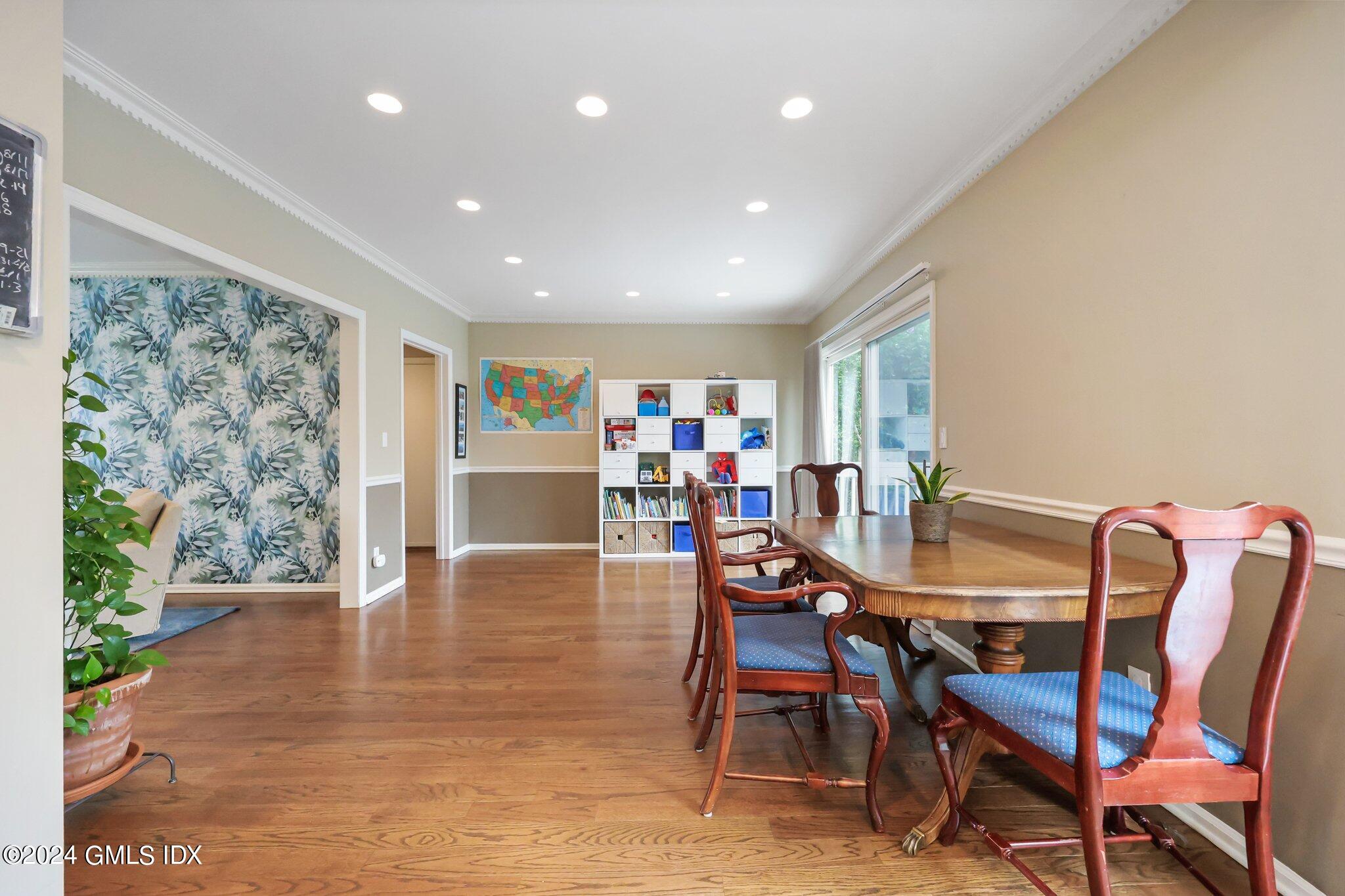 138 Byram Road, Unit 1 Greenwich, CT 06830 - Photo 11 of 36 a view of a dining room with furniture and wooden floor