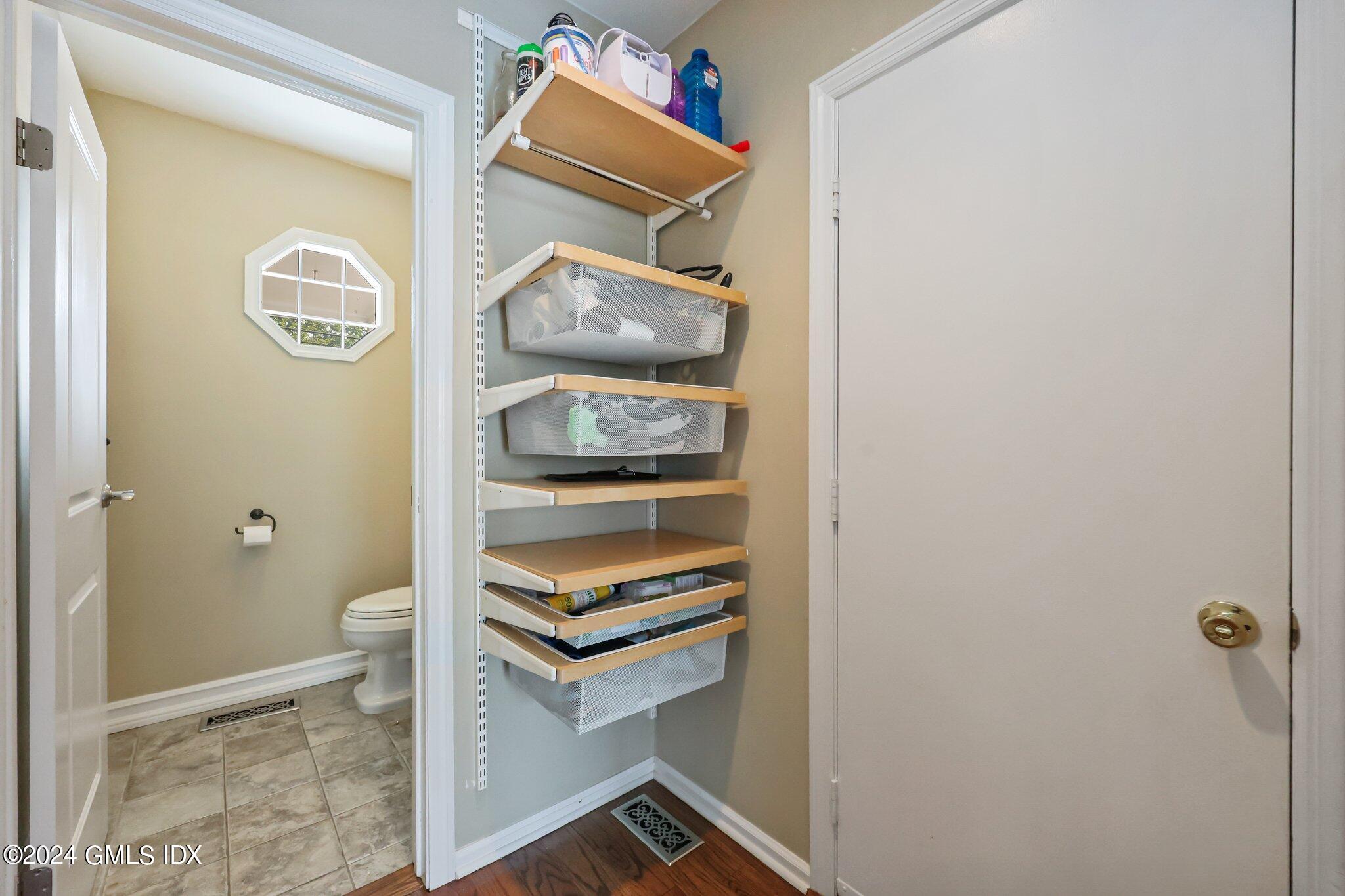 138 Byram Road, Unit 1 Greenwich, CT 06830 - Photo 18 of 36 a room with a wooden floor and shower