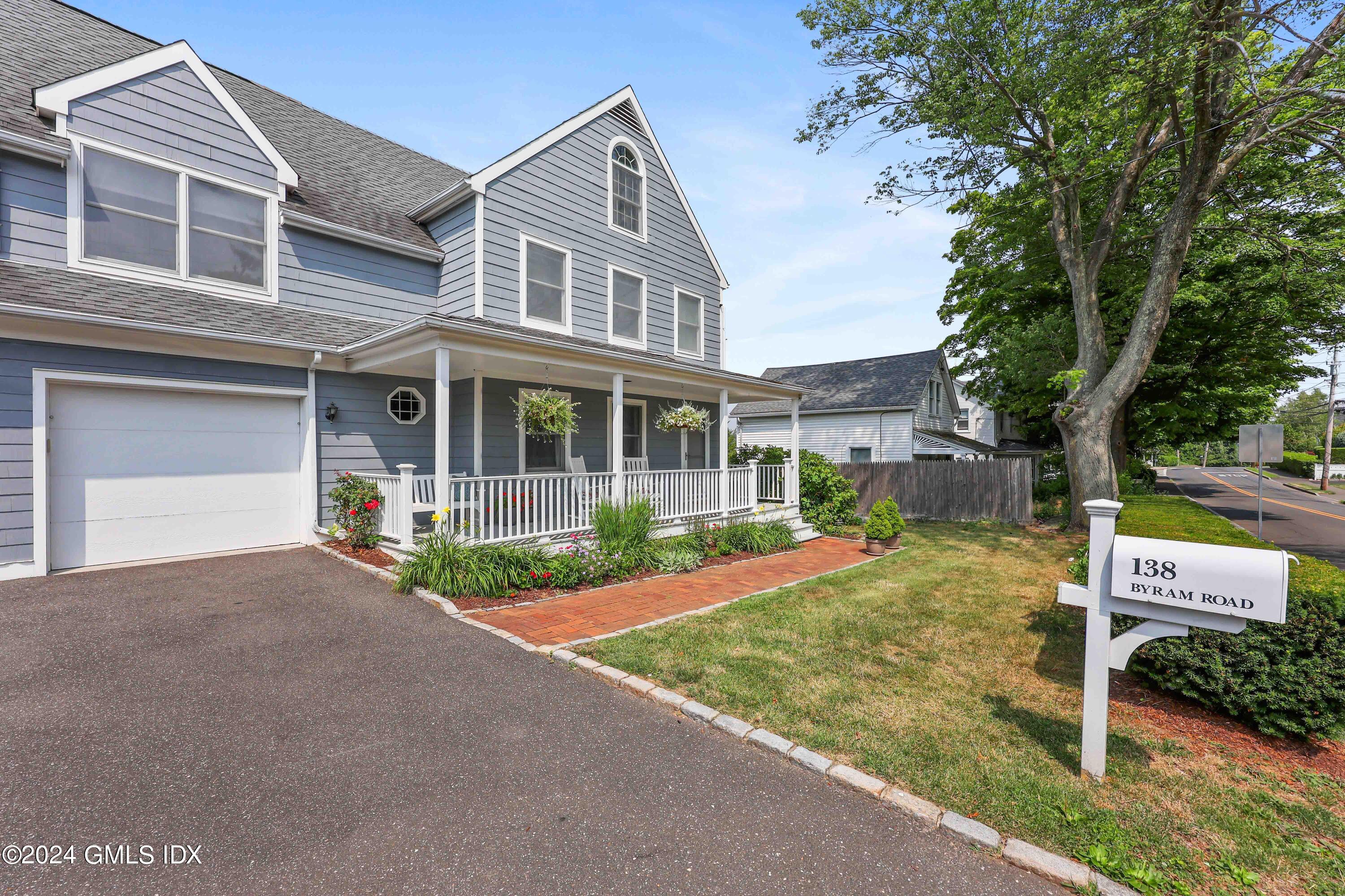 138 Byram Road, Unit 1 Greenwich, CT 06830 - Photo 2 of 36 front view of a house with a yard