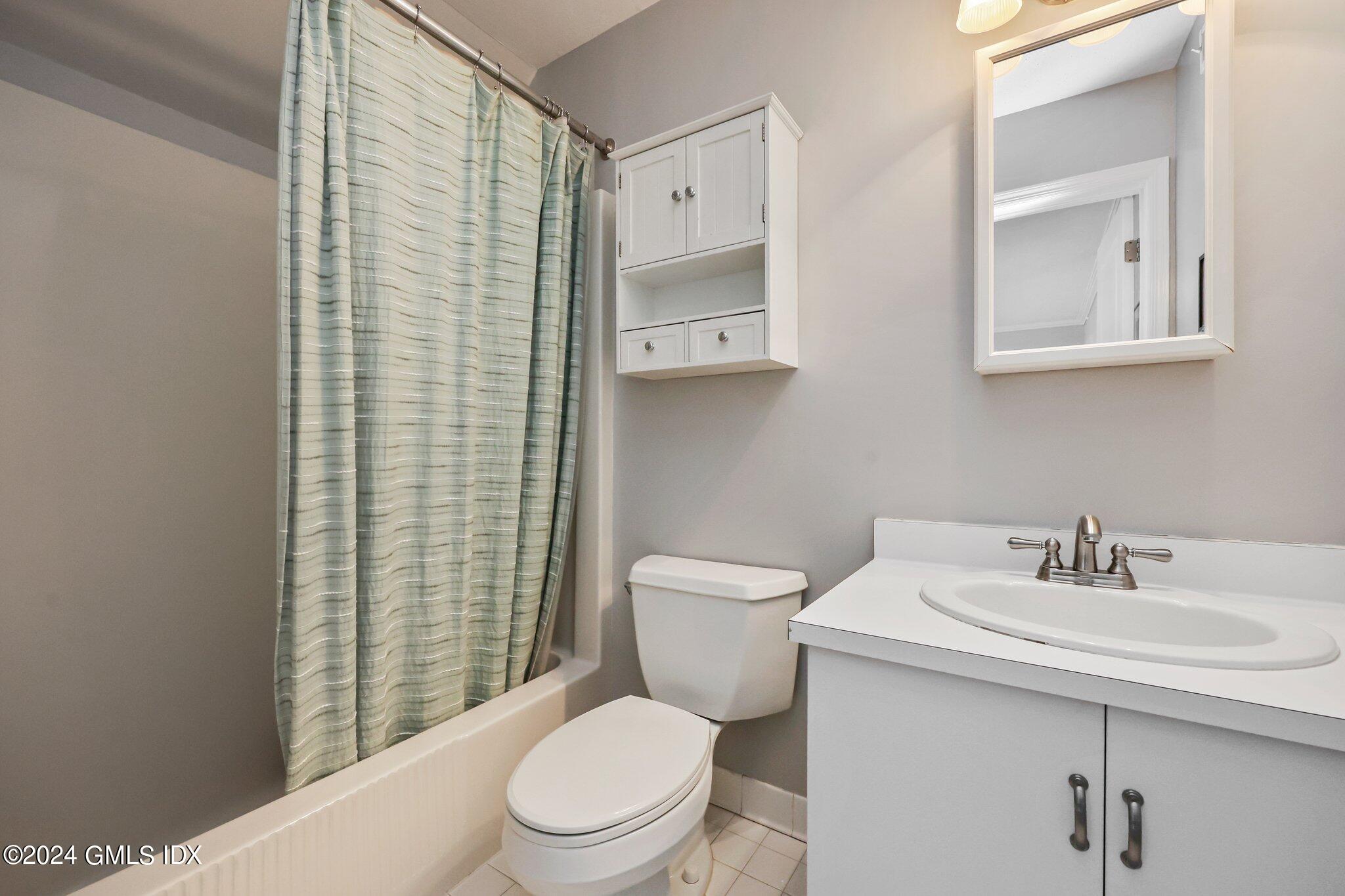 138 Byram Road, Unit 1 Greenwich, CT 06830 - Photo 22 of 36 a bathroom with a toilet a sink and shower