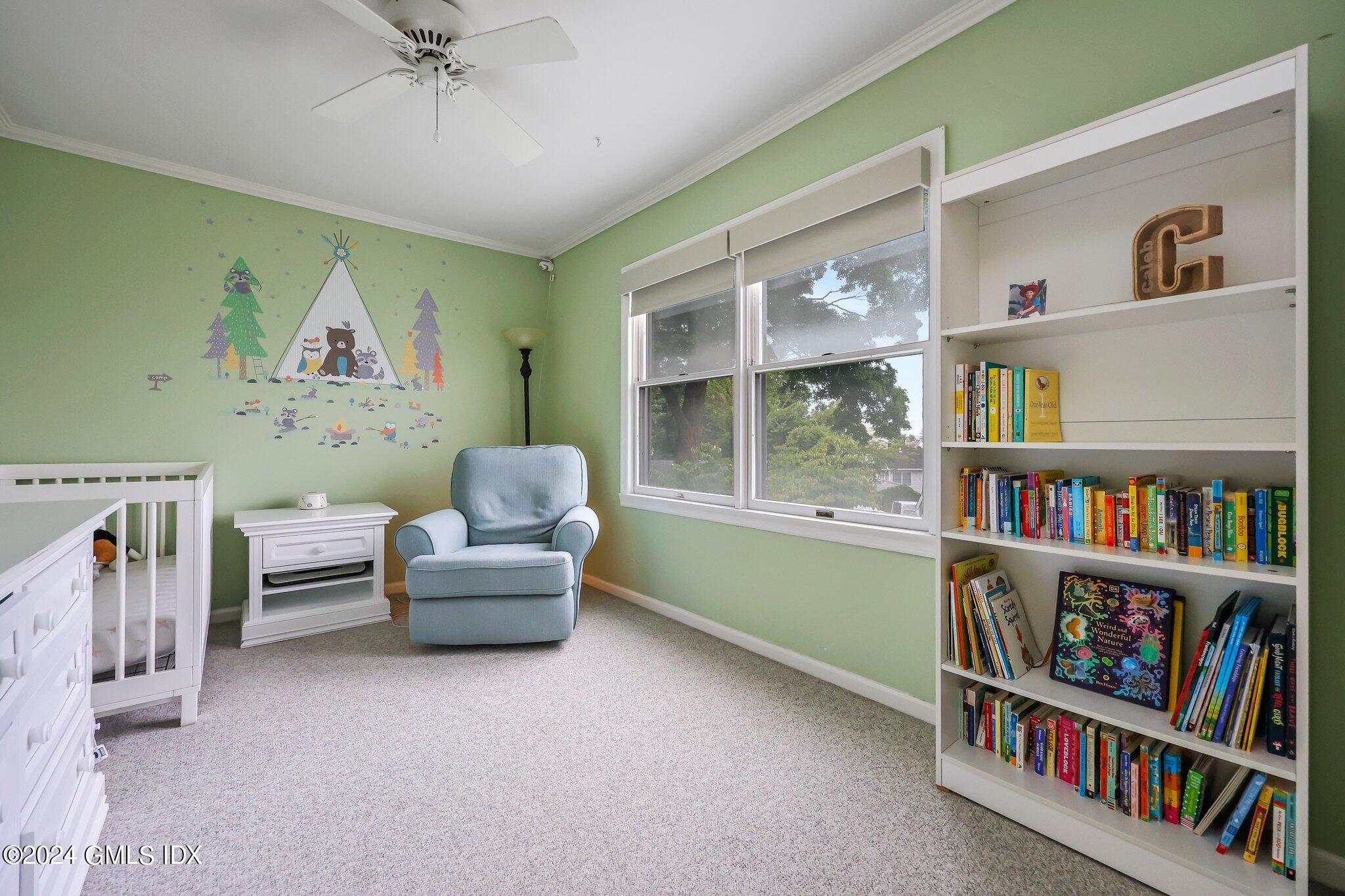 138 Byram Road, Unit 1 Greenwich, CT 06830 - Photo 27 of 36 a living room with furniture and a book shelf