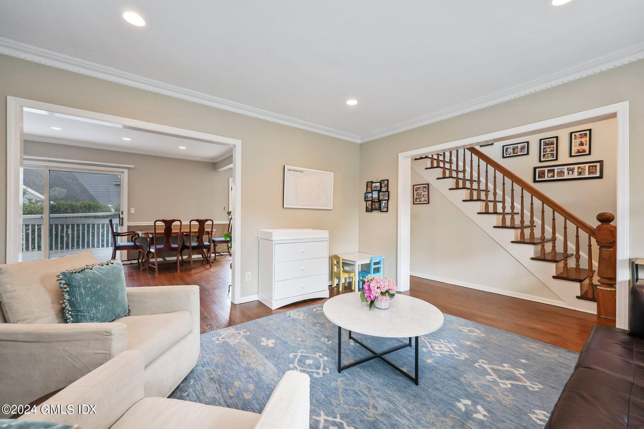 138 Byram Road, Unit 1 Greenwich, CT 06830 - Photo 5 of 36 a living room with furniture and a wooden floor