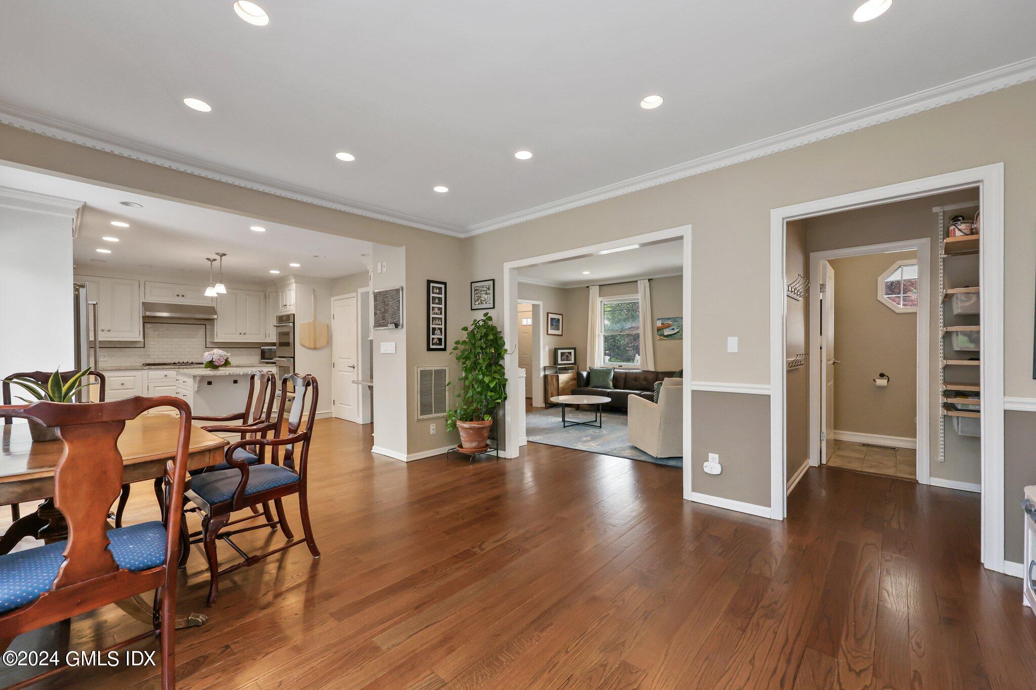 138 Byram Road, Unit 1 Greenwich, CT 06830 - Photo 9 of 36 a view of a dining room with furniture and wooden floor