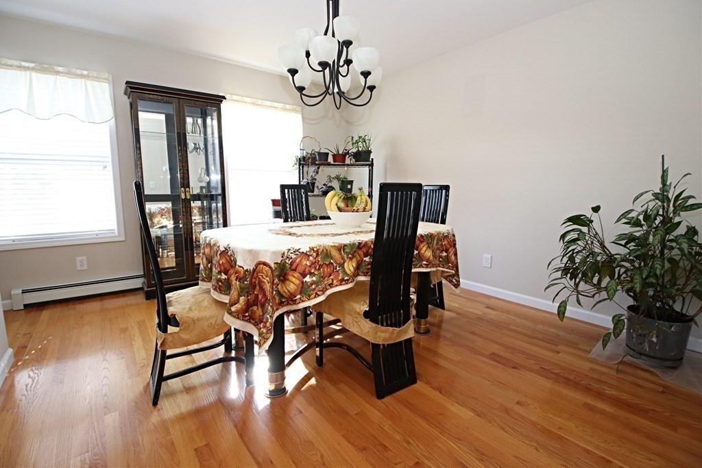 10 Pace Road Saugus, MA 01906 - Photo 15 of 42 a view of a dining room with furniture window and wooden floor