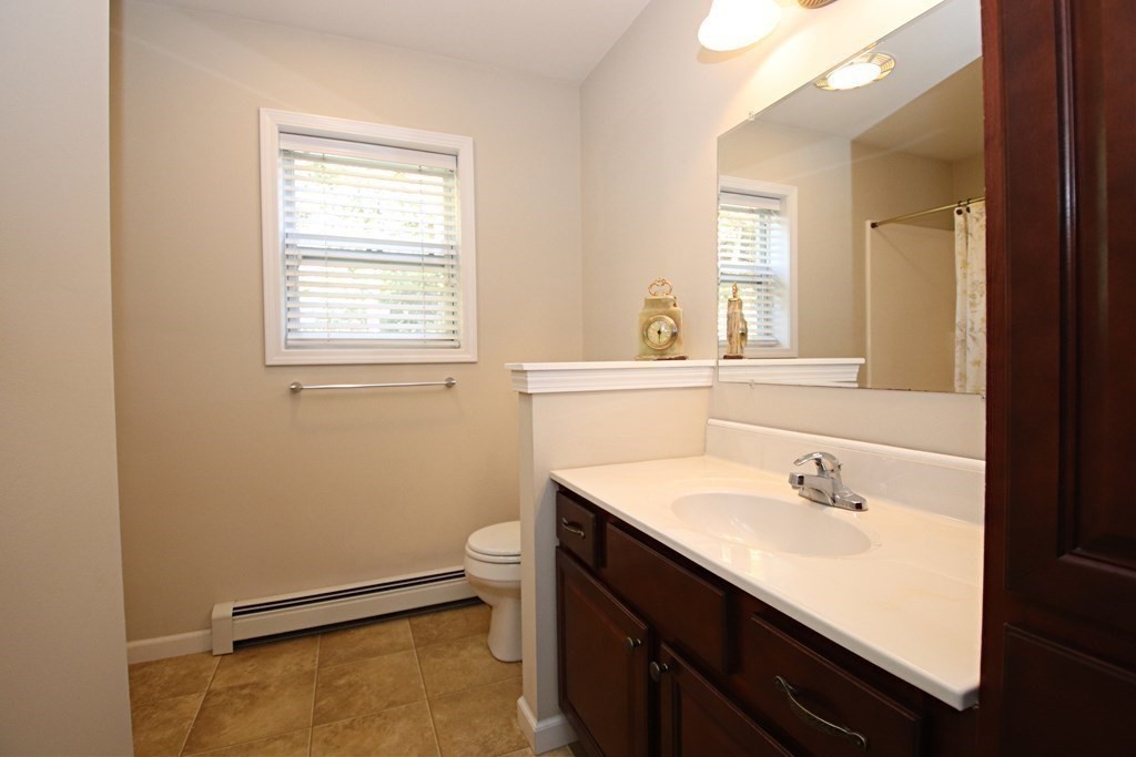 10 Pace Road Saugus, MA 01906 - Photo 18 of 42 a bathroom with a sink double vanity and a window