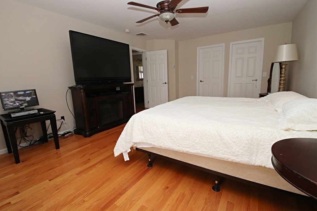 10 Pace Road Saugus, MA 01906 - Photo 23 of 42 a bed room with a bed tv and a chair