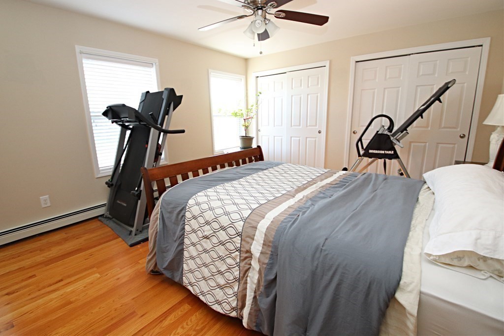 10 Pace Road Saugus, MA 01906 - Photo 26 of 42 a bed sitting in a bedroom next to a window