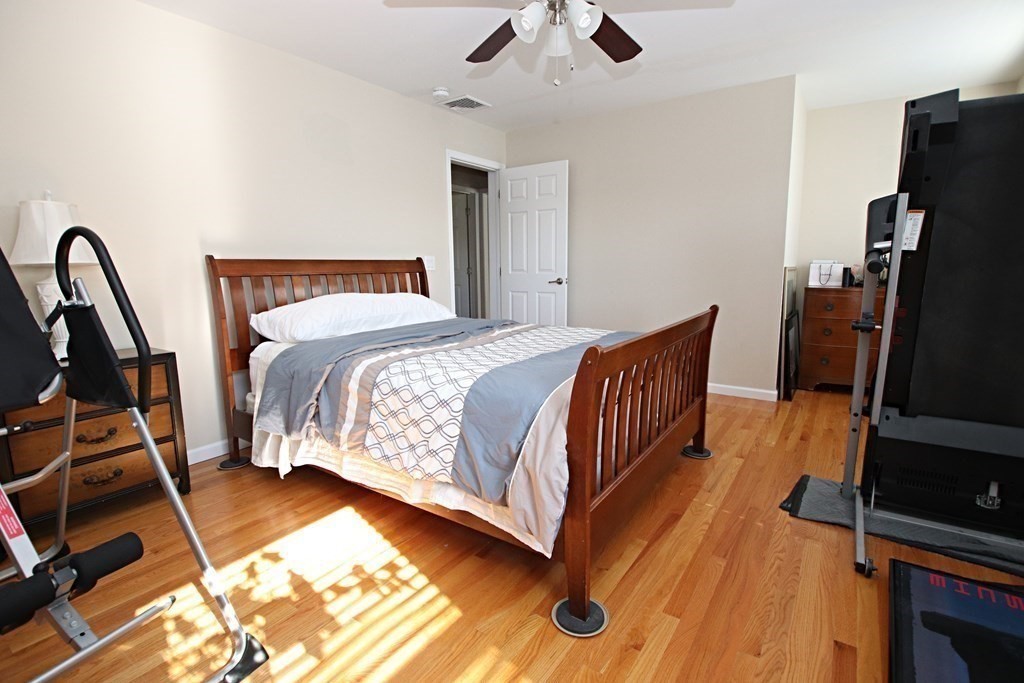 10 Pace Road Saugus, MA 01906 - Photo 28 of 42 a bedroom with bed and wooden floor