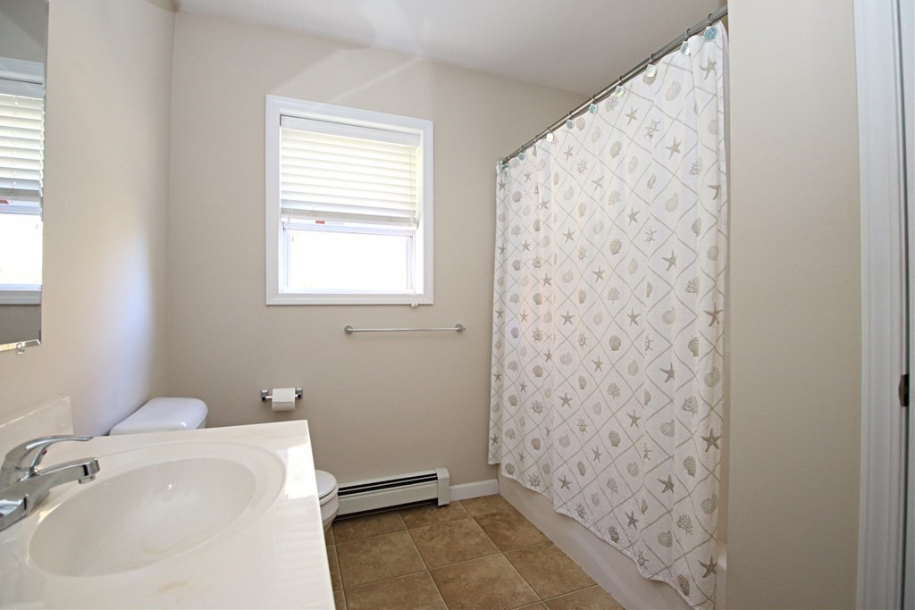 10 Pace Road Saugus, MA 01906 - Photo 33 of 42 a bathroom with a sink and a shower